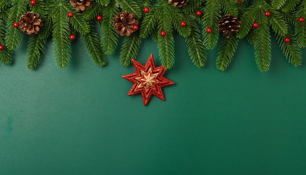 Happy new year, christmas day concept top view flat lay fir tree branches and decoration on Olive Green background with copy space for your text