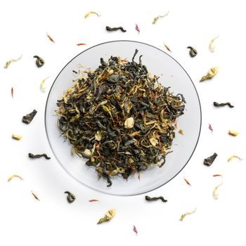 Green tea with natural aromatic additives. Top view on white background.