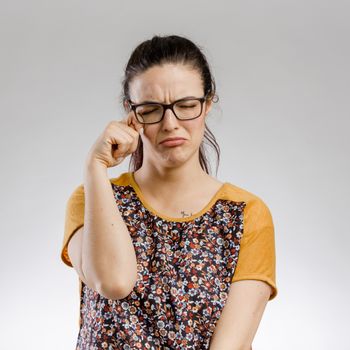 Portrait of a cute woman crying