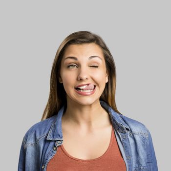 Portrait of a beautiful woman making crazy face