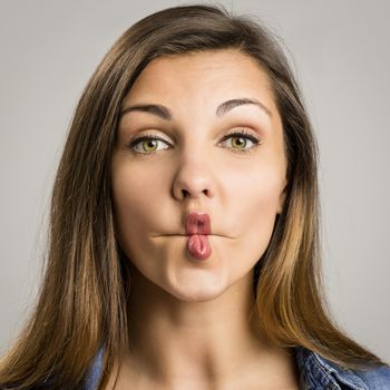 Portrait of a beautiful woman making a pout expression