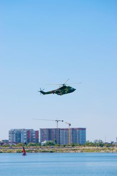 Bucharest/ Romania - AeroNautic Show - September 21, 2019: Puma IAR330 Helicopter flying above the lake.