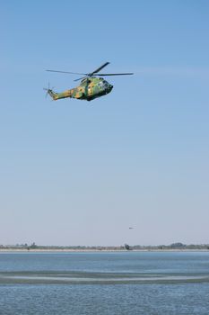 Bucharest/ Romania - AeroNautic Show - September 21, 2019: Puma IAR330 Helicopter flying above the lake.