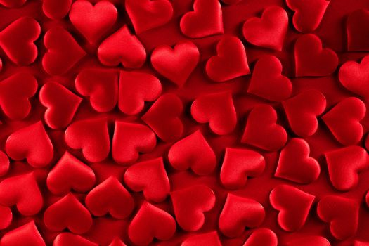 Valentine's day many red silk hearts background, love concept