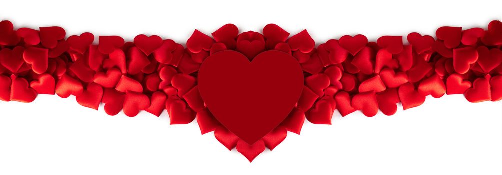 Valentine's day many red silk hearts and red heart shaped card isolated on white background, love concept