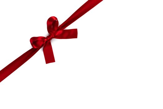 Red satin ribbon bow isolated on white background