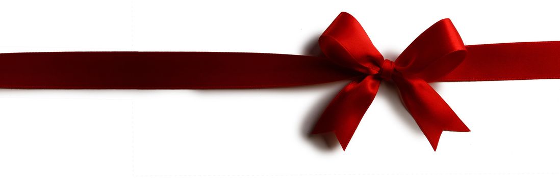 Red satin ribbon bow isolated on white background