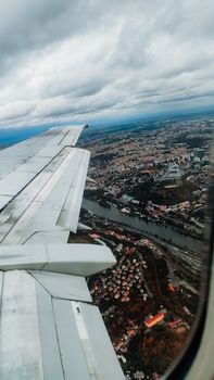 View of Prague from the window of the aircraft - vertical photo