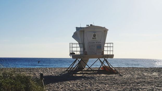 Life Guard Hut on Beach Against Blue Sky