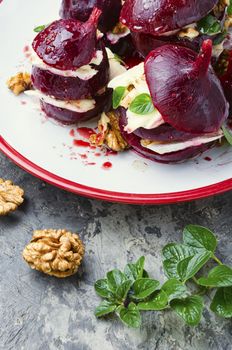 Boiled beetroot with soft cheese and walnut