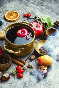 Alcoholic fruit drink sangria.Red hot wine and autumn fruits on the table.
