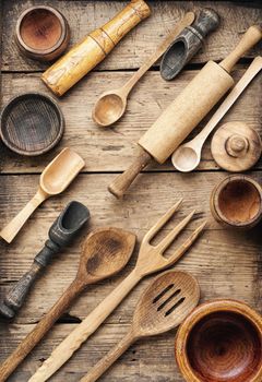 Concept of wooden rustic kitchenware utensils set on old background