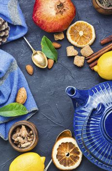 Natural ingredients for tea.Porcelain blue teapot.Useful tea with lemon.Herbal tea