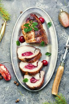 Sliced meatloaf filled with cherries.Christmas dish, festive food