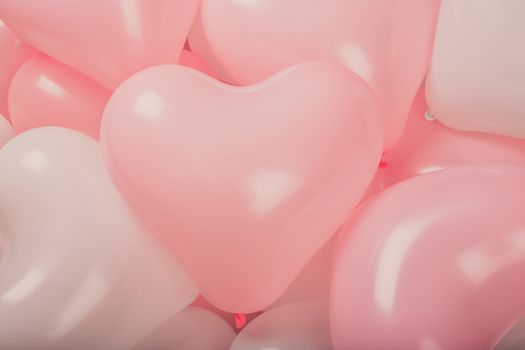 Happy valentines day greetings many heart shaped pink and white balloons background