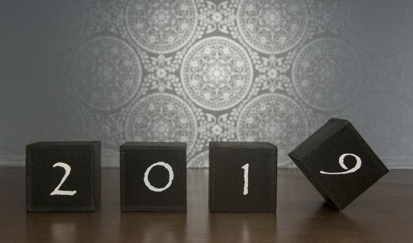 black blocks with 2018 changing in 2019 on dark background