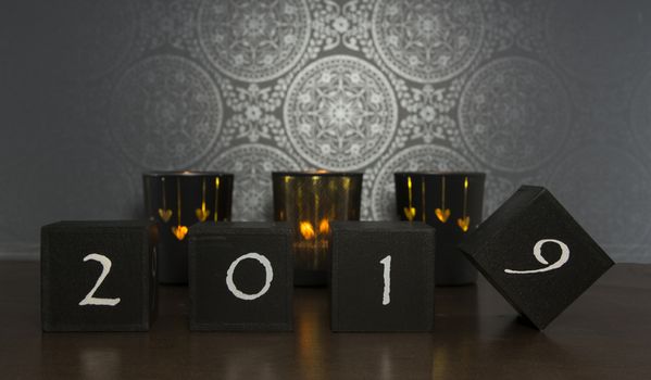 black blocks with 2018 changing in 2019 on dark background