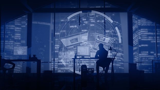 Silhouette of a web programmer sitting in his office with windows on a business center and infographics in front of him.