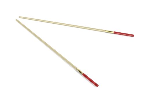 Pair of wooden chopsticks on white background