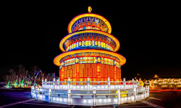 pagoda lantern festival by night with beatiful chinese light decorations .