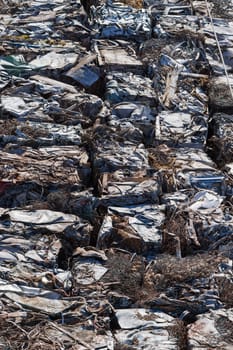 A garbage trash packs on a railway freight cars.