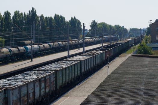 A train with freight cars full of garbage packs.