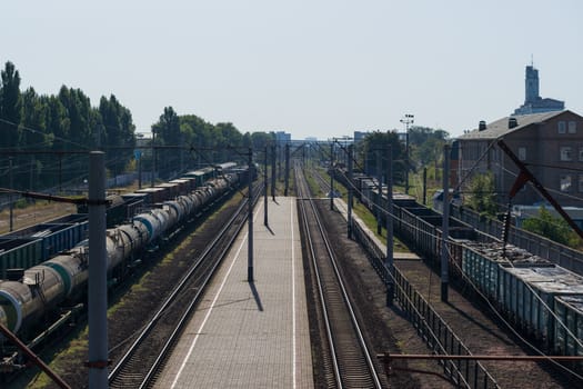 A train with freight cars full of garbage packs.