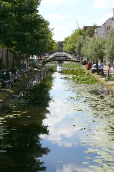 a canal with many consecutive arch bridges