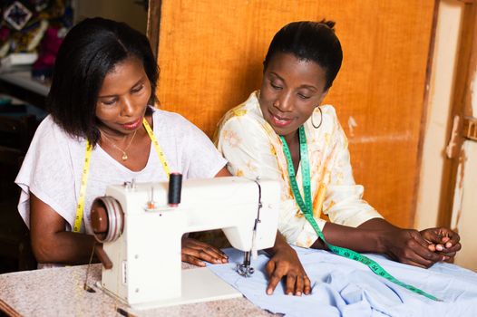 the student is happy to learn sewing and pleases her  teacher.