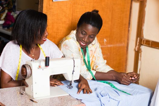 the student is happy to learn sewing and pleases her  teacher.