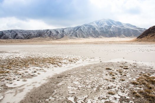 Mount Aso and Kusasenri in winter. covered by golden yellow grassland - Kumamoto, Japan