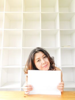 Beautiful woman smiling happy against white background.
