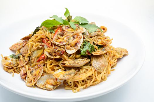 Stir fried noodles with clams and herbs, hot and spicy dish