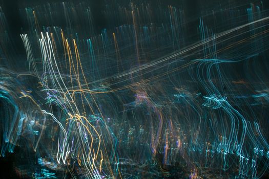 Abstract long exposure, experimental surreal photo, city and vehicle lights at night
