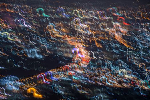 Abstract long exposure, experimental surreal photo, city and vehicle lights at night
