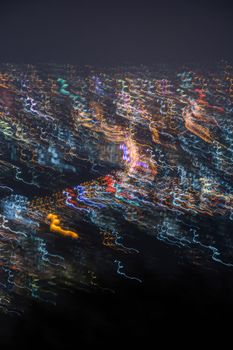 Abstract long exposure, experimental surreal photo, city and vehicle lights at night
