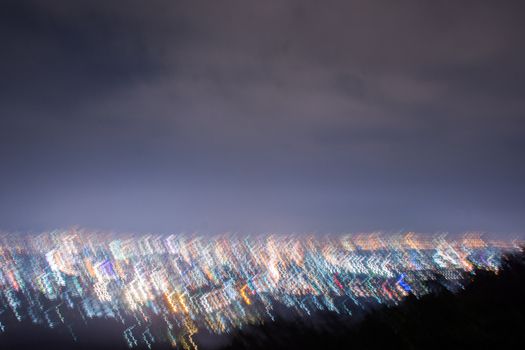 Abstract long exposure, experimental surreal photo, city and vehicle lights at night
