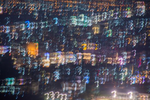 Abstract long exposure, experimental surreal photo, city and vehicle lights at night
