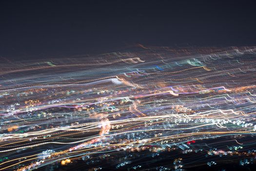 Abstract long exposure, experimental surreal photo, city and vehicle lights at night
