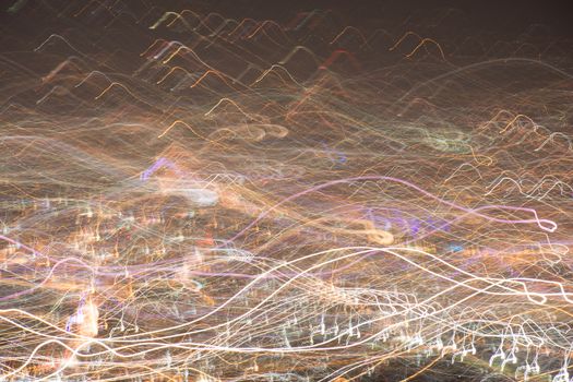 Abstract long exposure, experimental surreal photo, city and vehicle lights at night
