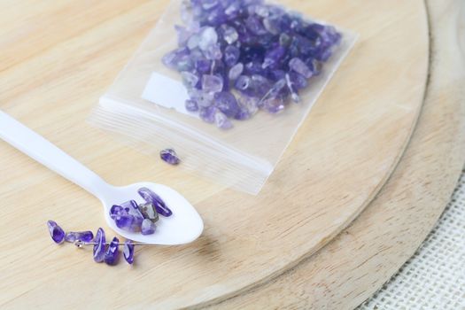 Colorful beads on a wooden surface. Various of shapes and colors to make jewelry
