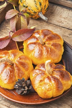 Fragrant homemade buns made from pumpkin dough.