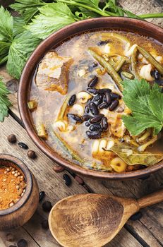 Plate with meat soup with beans.Winter food.