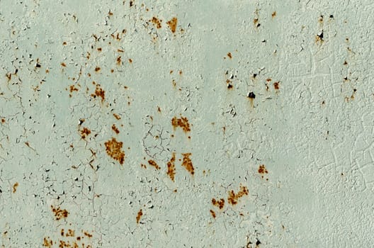 background texture pattern of old rusty iron wall with green paint close up