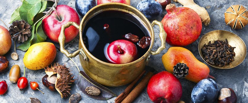 Mulled wine in a stylish bowl.Mulled wine with autumn fruits