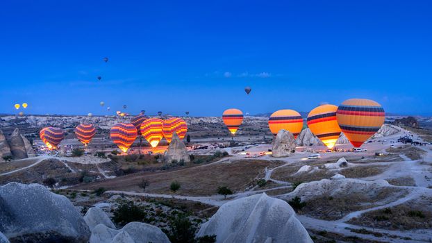 Vibrant colorful hot air balloons in Cappadocia, Turkey.