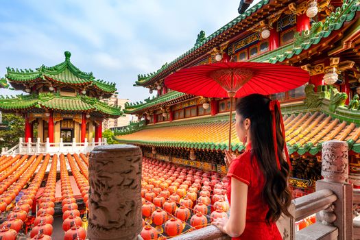 Asian woman wearing traditional Chinese dress at Sanfeng Temple in Kaohsiung, Taiwan.