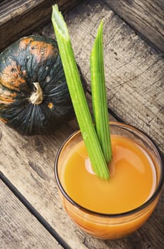 Fresh pumpkin juice.Autumn pumpkin drink.Juice on wooden table