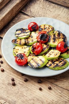 Grilled vegetables on wooden table.Large portion of grilled vegetables