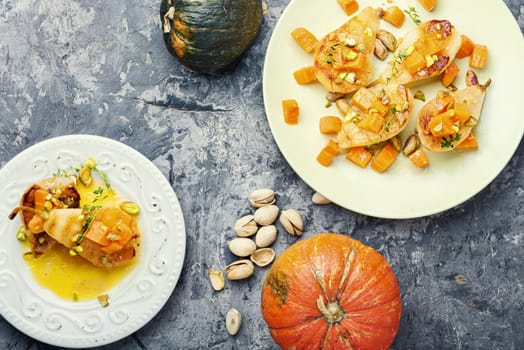 Stuffed pear pumpkin and pistachio.Homemade baked pears. Autumn food.